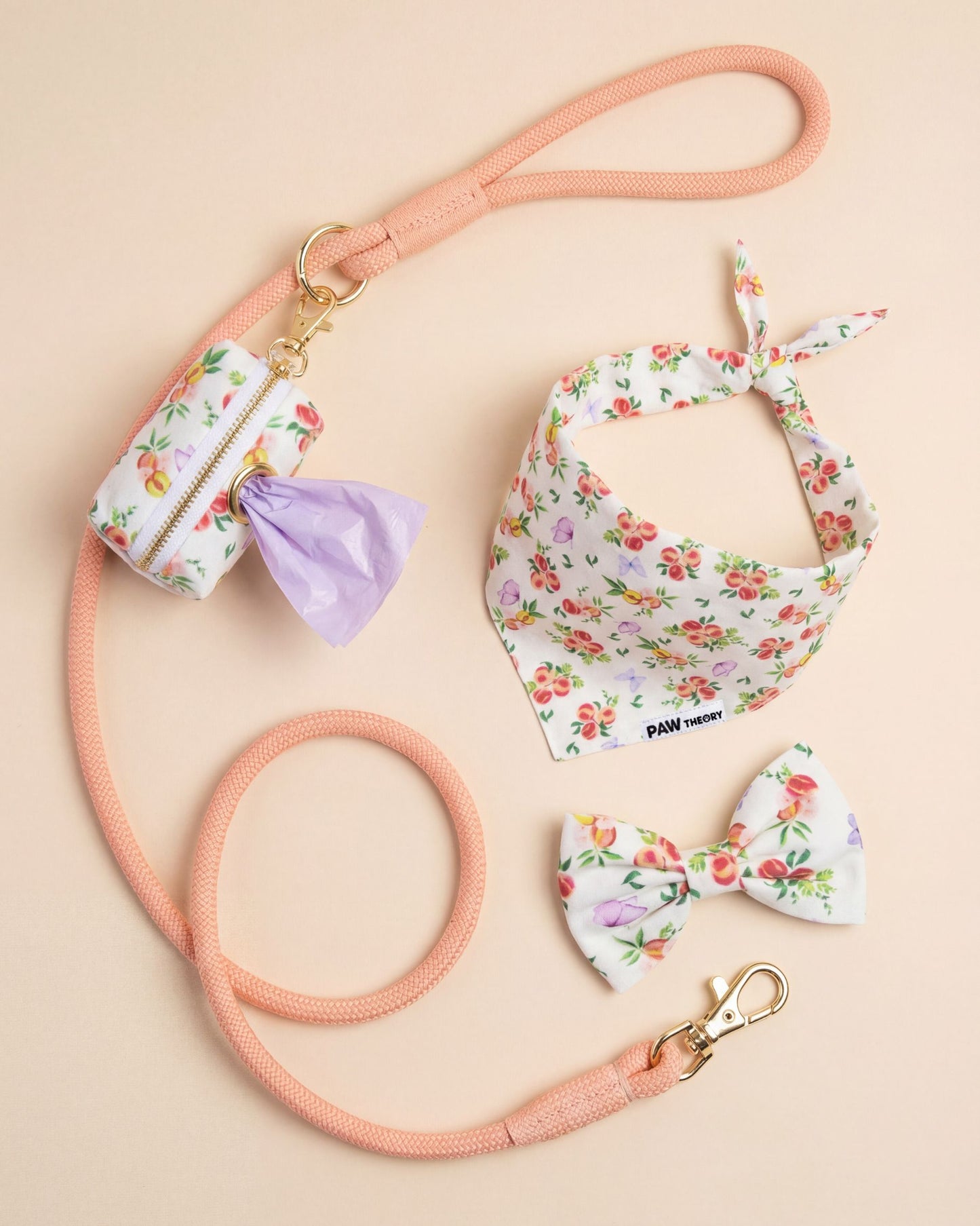 Dog leash, bandana, and bow tie set with floral peach asthetic pattern on a beige background