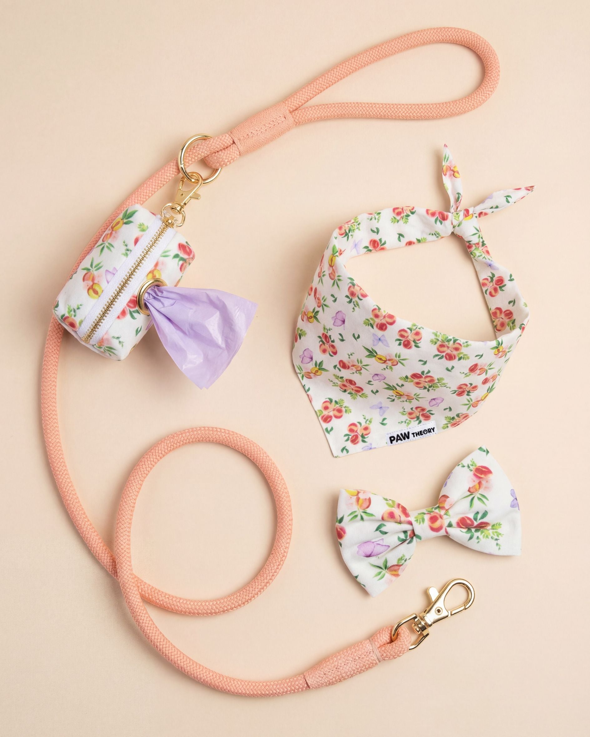 Dog leash, bandana, and bow tie set with floral peach asthetic pattern on a beige background