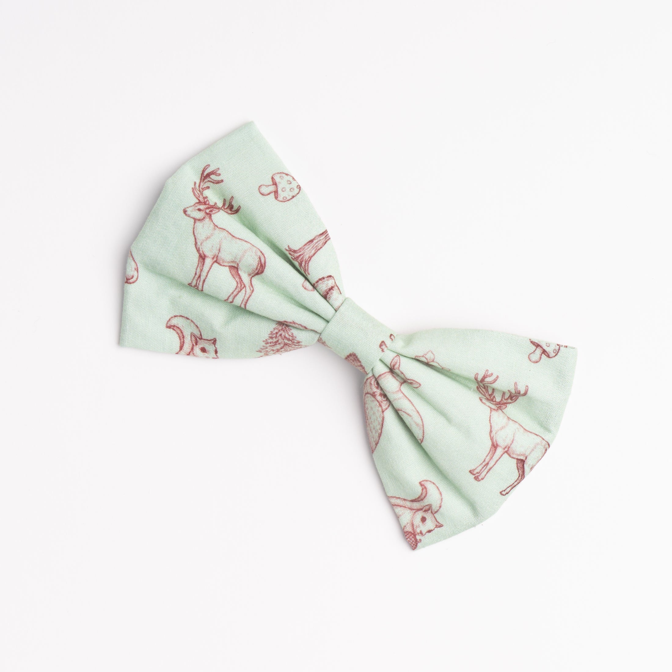 Forest Dweller dog bowtie diagonal view — earthy green fabric with handcrafted detail