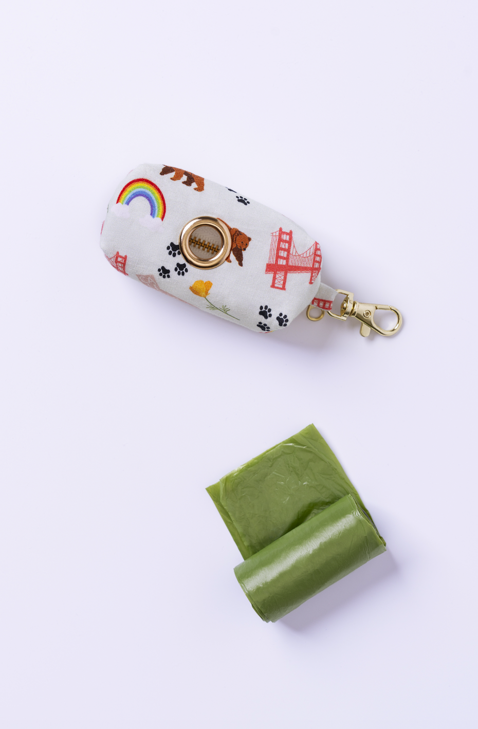 California Pride dog bowtie and waste bag holder detail from the Paw Theory Pets matching set
